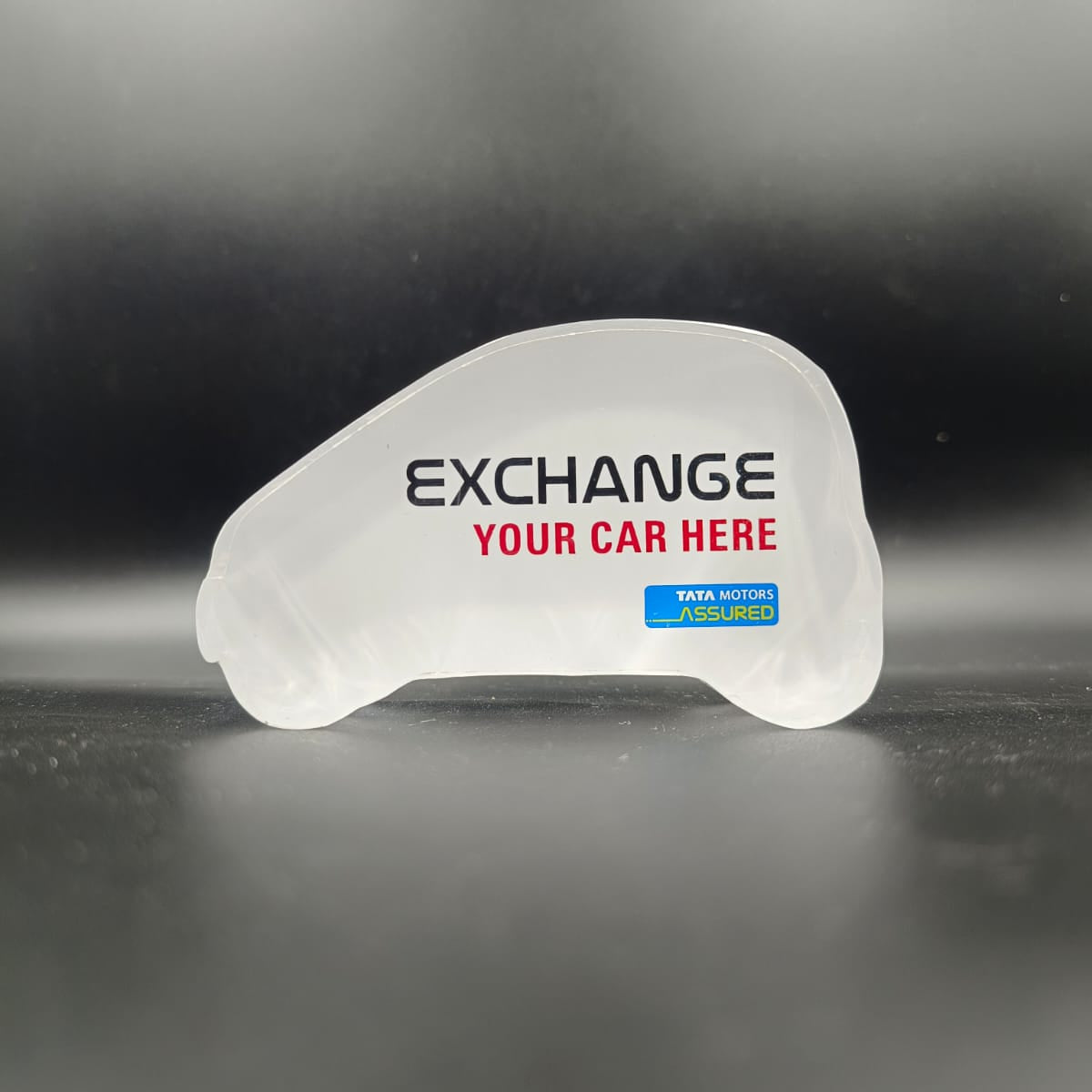 Tata Motors Assured Acrylic Car-Shaped Tabletop Exchange Stand